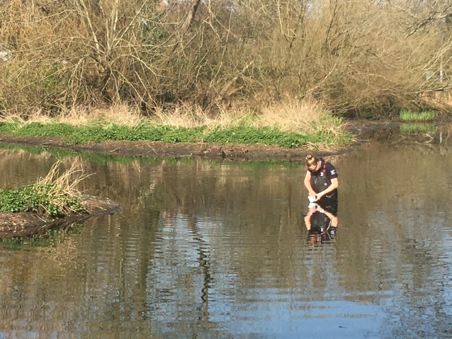 Taking a silt sample